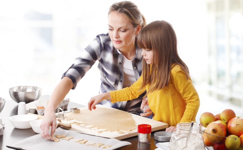 Little Girl and Mother Baking